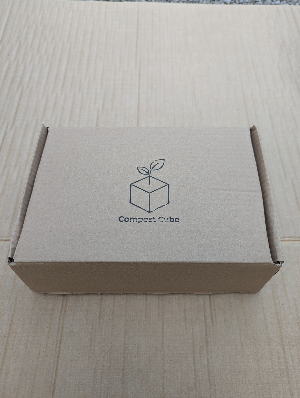 Compost Cube branded cardboard box, closed