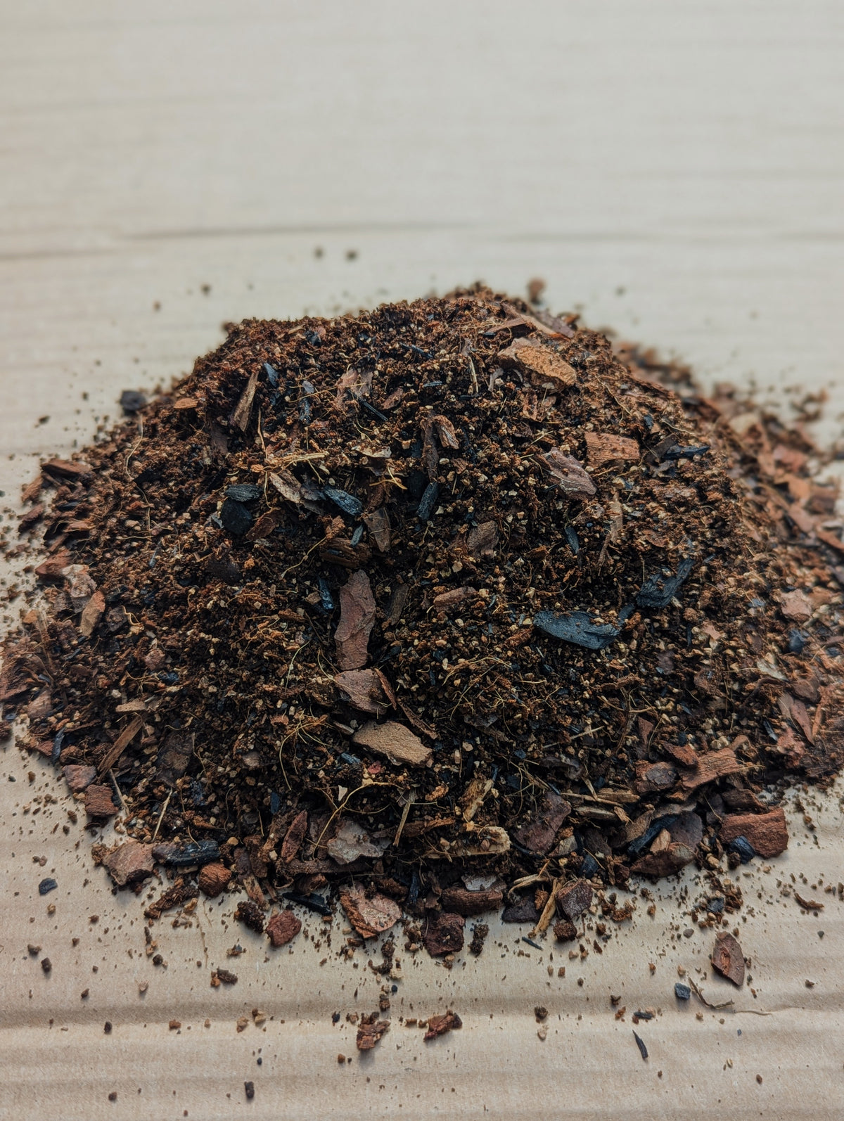 Chunky fast-draining compost mix with visible orchid bark and biochar