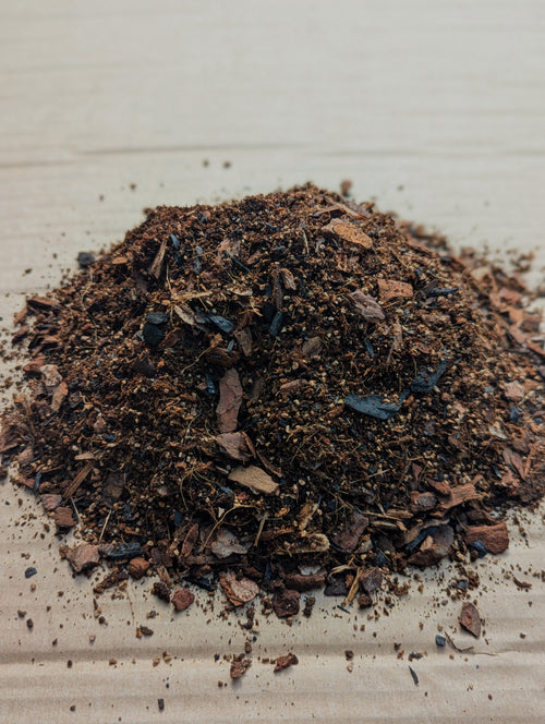 Chunky fast-draining compost mix with visible orchid bark and biochar